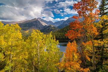 colorful aspen above bear lake with view of longs peak