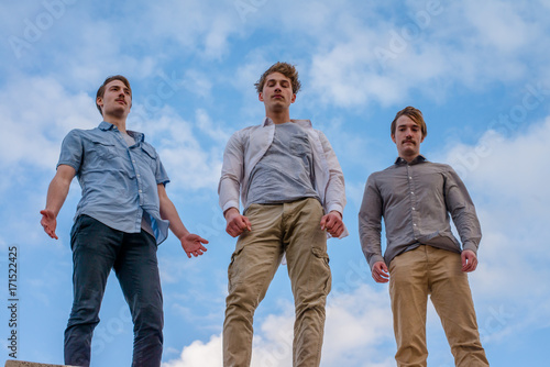 Three Young Men Posing Photo Shot From A Low Angle Buy This