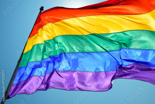 Fotomural Rainbow flag on clear sky symbol of tolerance and acceptance