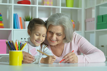 Canvas Print - Grandmother with granddaughter drawing together