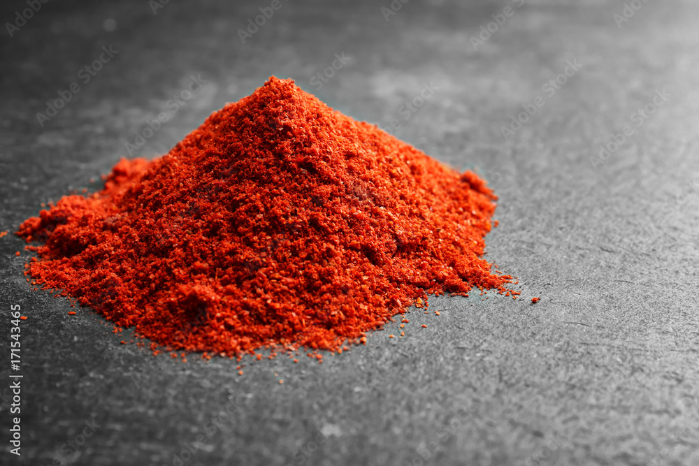 Pile of goji powder on grey background