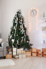 Wall Mural - Decorated room with beautiful Christmas tree and gifts