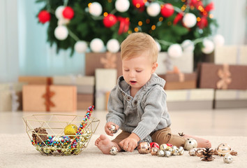 Sticker - Cute little baby playing with Christmas decor at home