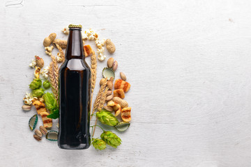 Canvas Print - A bottle of beer, hops and grain. Top view. Free space for text.