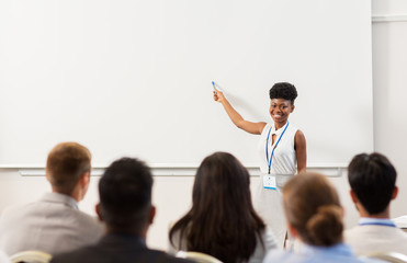 group of people at business conference or lecture