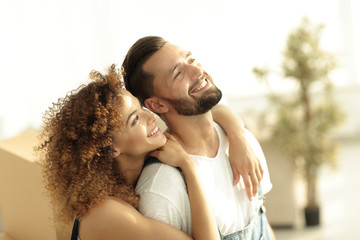 Portrait of a loving married couple in a new apartment.