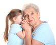 © Africa Studio - Cute little girl with her grandmother on white background