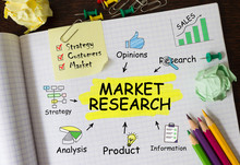 Notebook With Tools And Notes About Market Research