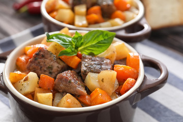  Casserole with tasty meat and potatoes on table