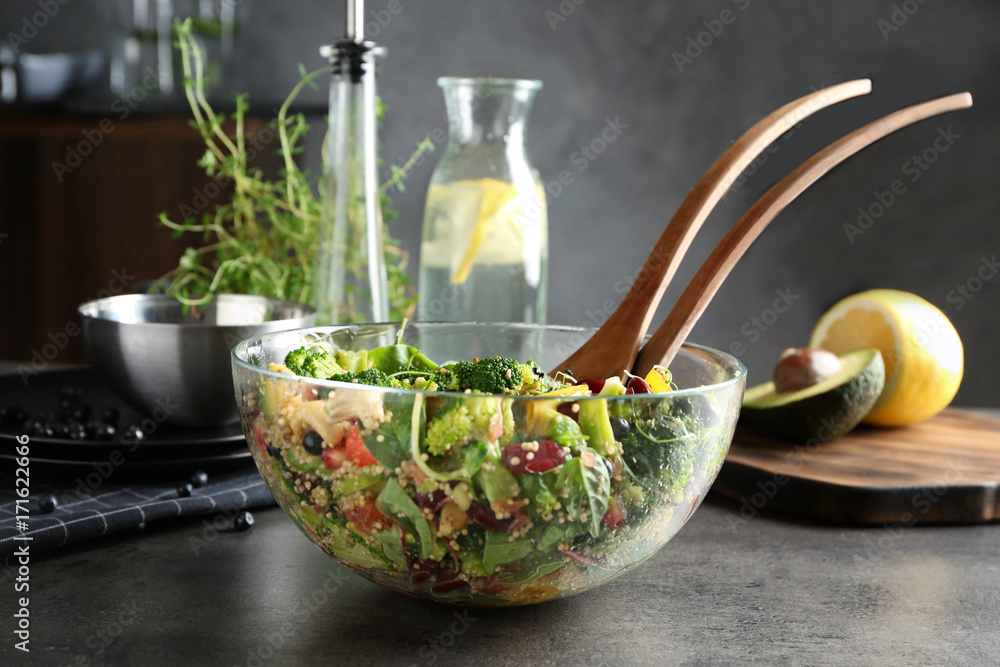Superfood salad in glass bowl on kitchen table