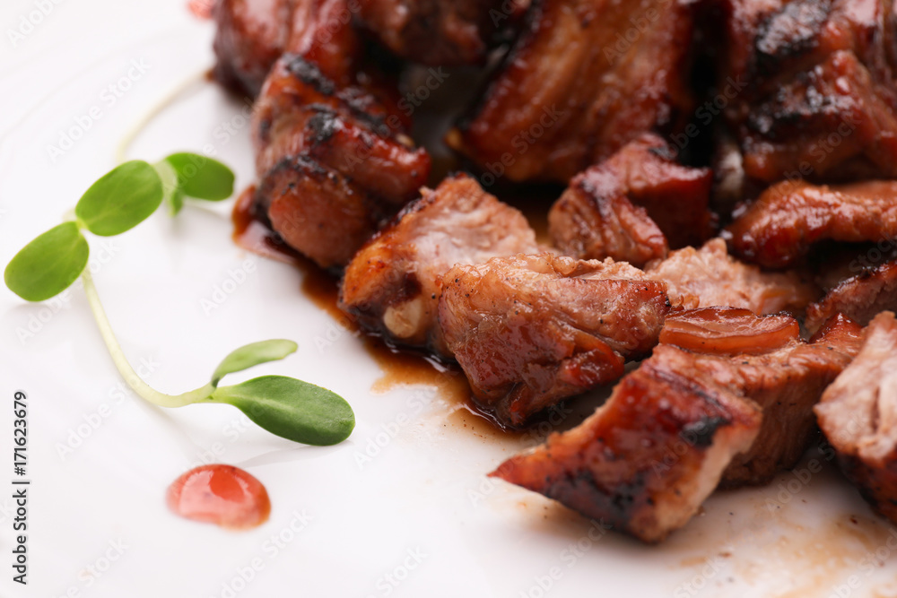 Delicious ribs on plate, closeup