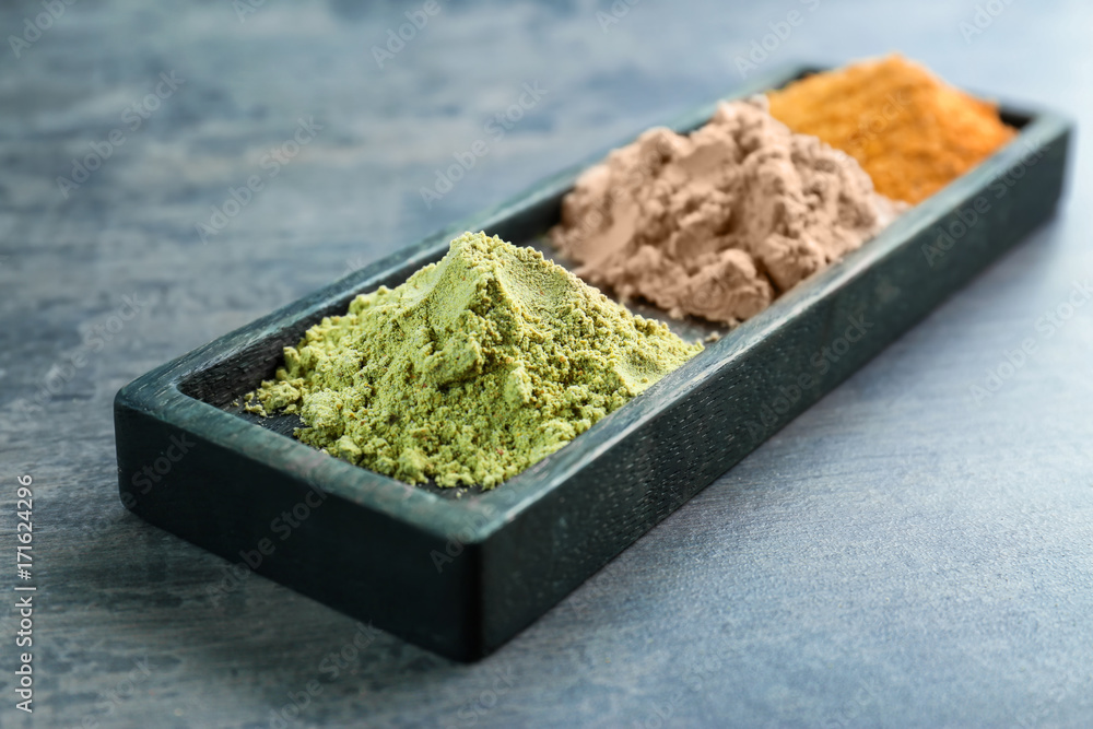 Various colorful superfood powders on color background