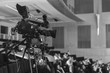 © Luis Cerdeira/Stocksy - A camcorder recording during a congress