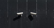 © Marko Milanovic/Stocksy - Security cameras on wall