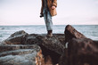 © Thais Ramos Varela/Stocksy - man with his camera in the beach