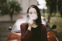 Portrait Of Real Young Smoking Woman