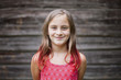 © Carleton Photography/Stocksy - Headshot of nine year old girl with brown and red hair
