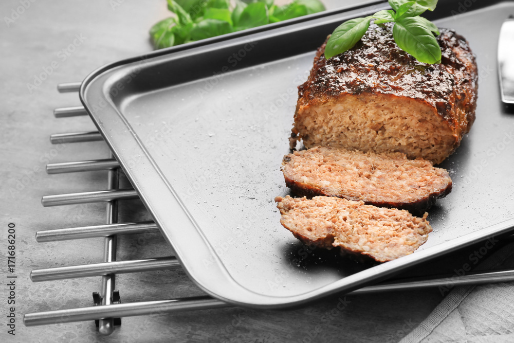 Tasty turkey meatloaf on baking tray