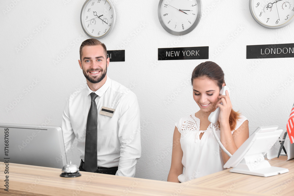 Two hotel receptionists at workplace