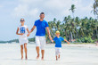 © Max Topchii - Family of three having fun at the beach