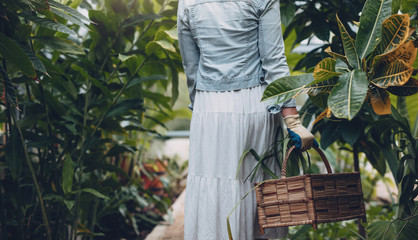 Woman walking with basket in the nursery