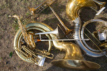 lot of golden and steel musical copper wind instruments