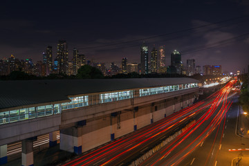 Night landscape of EDSA road and Makati at background