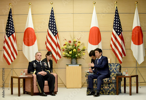 japanese prime minister shinzo abe talks with chief of staff of the