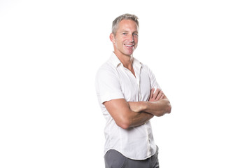 Portrait of confident mature man standing on white background