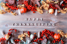 Thanksgiving Day Autumn Background With With Happy Thanksgiving Letters, Seasonal Autumn Berries, Pumpkins, Apples