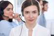 © rogerphoto - Call center operator.Young beautiful business woman in headset