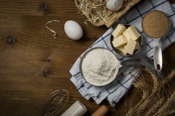 Wall Mural - Baking ingredients in measuring cups