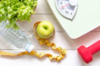 © freebird7977 - Green apple and Weight scale,measure tap with fresh vegetable, clean water and sport equipment for women diet slimming.  Diet and Healthy Concept.