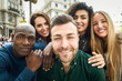 © javiindy - Multiracial group of young people taking selfie