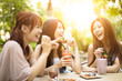 © Tom Wang - Group of young woman laughing in restaurant