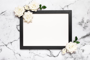 Blank picture frame on white marble table top view, Mock up for adding your photo in copy space, wedding, mother's day, celebration event