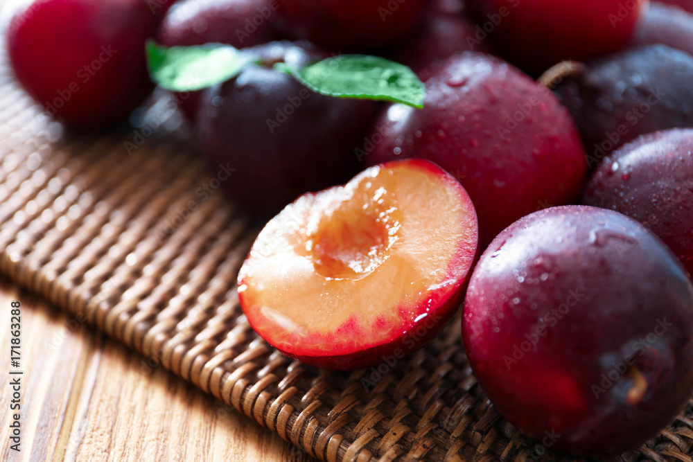 Fresh ripe plums on table, closeup