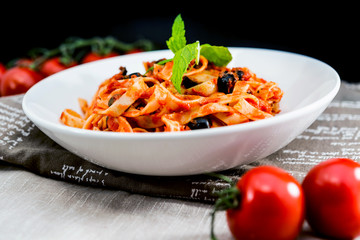 Wall Mural - Spaghetti with tomato sauce on a the table