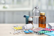 Different medicines and pills on wooden table