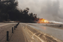 Road Through Oil Well Burning In Field With Oil Slick, Kuwait