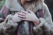 Woman in Fur Coat with Wedding Rings