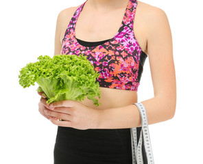 Wall Mural - Young woman with measuring tape and lettuce on white background. Diet concept