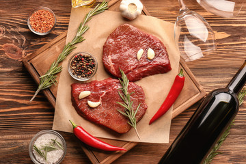 Poster - Fresh raw meat with rosemary on wooden board