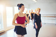 © Flamingo Images - Joyful adult women standing in ballet class