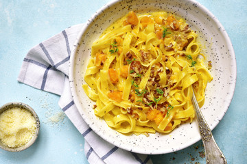 Wall Mural - Tagliatelle with pumpkin in a cream sauce.Top view.