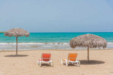 Wall Mural - Beach umbrellas on Caribbean sea