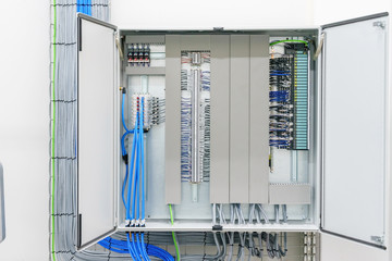 electricity distribution box with wires and circuit breakers (fuse box)