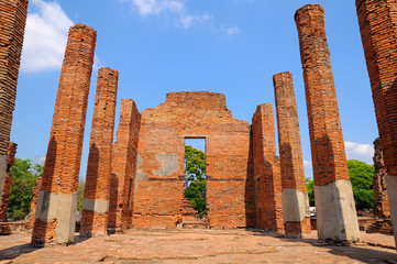 Wat Mahathat, a ruined ancient Buddhist temple with blue sky / Wat Mahathat, a ruined ancient Buddhist temple with blue sky in Ayutthaya province, Thailand