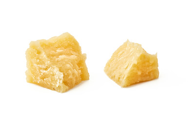 Pieces of Parmesan cheese on white background. Macro photography with great depth of field. DoF .