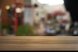 © Charlie's - Empty dark wooden table in front of abstract blurred background of cafe and coffee shop interior. can be used for display or montage your products.